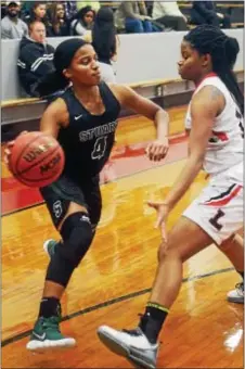  ?? GREGG SLABODA — TRENTONIAN PHOTO ?? Stuart’s Jasmine Hansford, left, drives on Lawrencevi­lle’s Taylor Thompson during Thursday’s game.