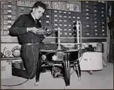  ?? ?? Earl Jr. fixing a washer 1942