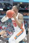  ?? TOM PENNINGTON/GETTY IMAGES ?? Florida’s Keith Stone drives to the basket against St. Bonaventur­e in the first half on Thursday.