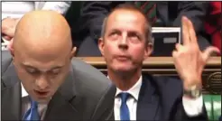  ??  ?? Bang: Nick Boles, behind Sajid Javid, pretends to shoot himself