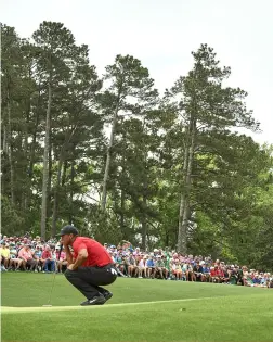  ?? ?? G R E E N ( J A CK E T ) D AY
Woods shot a final-day 70 to finish the tournament at 13-under, a stroke ahead of Johnson, Koepka and Schauffele.