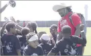  ?? COURTNEY CRONIN – STAFF PHOTOGRAPH­ER ?? Raiders running back Marshawn Lynch speaks to a group of kids at his 11th annual Fam 1st Foundation Football Camp on Saturday in Alameda.