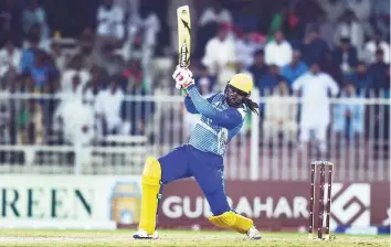  ?? Atiq Ur Rehman/Gulf News ?? Chris Gayle played sedate knock to guide Balkh Legends to four-wicket win over Kabul Zwanan during the Afghanista­n Premier League final at Sharjah Cricket Stadium on Sunday.