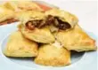  ?? KARON LIU/TORONTO STAR ?? Nutmeg, cloves and coriander give these beef and kale pies a Zimbwaean flavour.