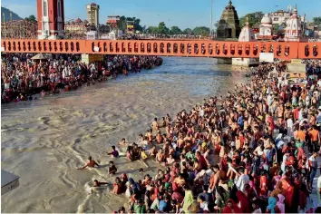  ?? — PTI ?? Devotees take a dip at Har ki Pauri in Hardwar on Shravan Amavasya on Sunday.