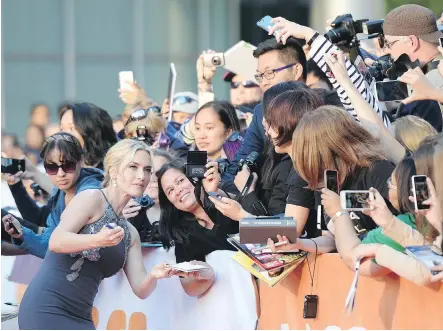  ?? FRANK GUNN/THE CANADIAN PRESS FILES ?? Kate Winslet is greeted by a typically exuberant TIFF crowd at the 2015 festival. Cameron Bailey, artistic director of TIFF, cites the enthusiasm of Toronto audiences when it comes to the many pluses of the 41-year-old festival.