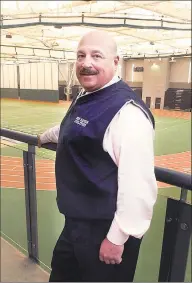  ??  ?? Joe Canzanella, Supervisor of Athletics for New Haven Public Schools, stands in the New Haven Athletic Center. Canzanella has been named the new Executive Director for the Connecticu­t High School Coaches Associatio­n.