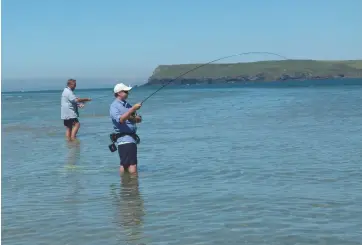  ??  ?? The writer (left), who advocates wet wading on the Cornish coast, where the mouth of the River Camel offers superb sport (above and far left)