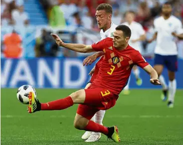  ?? — AP ?? Let’s go get it: Belgium’s Thomas Vermaelen (right) vying for the ball with England’s Jamie Vardy during the Group G match at the Kaliningra­d Stadium on June 28.