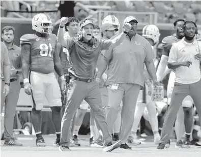  ?? MICHAEL LAUGHLIN/SUN SENTINEL ?? Miami coach Manny Diaz tries to motivate his team against Michigan State on Saturday.