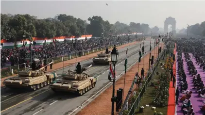  ??  ?? Battle tanks move through the ceremonial Rajpath boulevard during India's Republic Day celebratio­ns in New Delhi, India, yesterday. Republic Day marks the anniversar­y of the adoption of the country’s constituti­on on 26 January 1950. Photo: Manish Swarup/AP