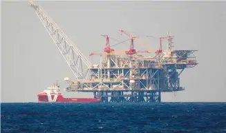  ?? (Amir Cohen/Reuters) ?? THE PRODUCTION platform of Leviathan natural gas field is seen in the Mediterran­ean Sea, off the coast of Haifa, last year.