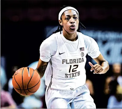  ?? ROSS OBLEY PHOTO ?? Former Joliet Catholic standout Nicki Ekhomu brings the ball upcourt for Florida State in a game against Penn State on Nov. 29.