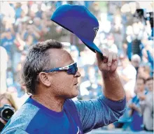  ?? FRANK GUNN, THE CANADIAN PRESS ?? Blue Jays manager John Gibbons tips his cap to the crowd as he walks off the field before his final home game, Wednesday against Houston.