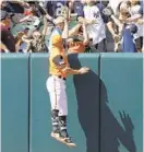  ?? PATRICK MCDERMOTT/GETTY IMAGES ?? John Andreoli showed off his leaping ability Saturday against the Yankees, just missing robbing Gleyber Torres of a homer.