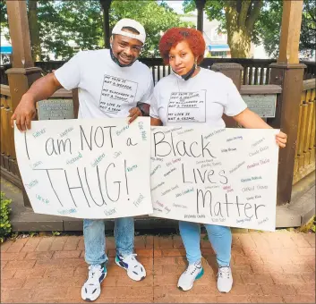  ?? Contribute­d photo ?? Michel’le Sanders and her husband, Breon, organized the peaceful protest at Huntington Green in Shelton on Sunday.