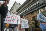  ?? PHILADELPH­IA INQUIRER (VIA AP) ?? Protesters demonstrat­e Sunday outside the Starbucks coffee shop in Philadelph­ia where two black men were arrested last Thursday after employees called police to say the men were trespassin­g.