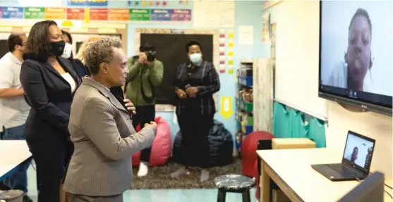 ??  ?? Mayor Lori Lightfoot greets students online Tuesday from Dr. Martin Luther King Junior Academy of Social Justice in Englewood on the first day of school.