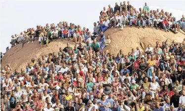  ?? REUTERS African News Agency (ANA) ?? THE mining community gathers at the “Hill of Horror” during a memorial service for miners killed during clashes at Lonmin’s Marikana platinum mine in Rustenburg, in August 2012. | |