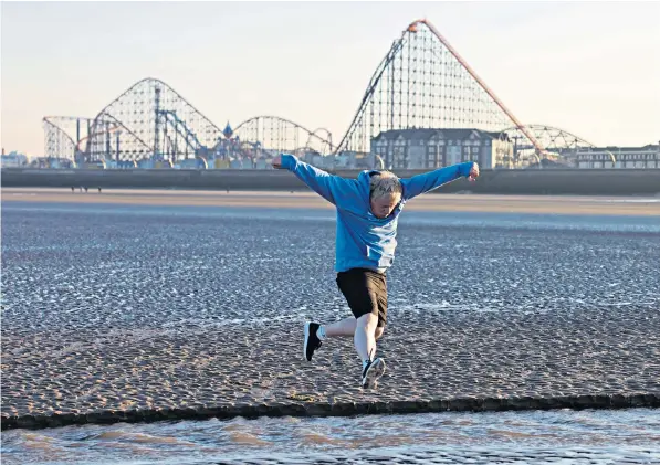  ?? ?? Prime Minister Boris Johnson takes time out to go running on the beach in Blackpool ahead of his speech to the Conservati­ve Party’s Spring Conference at the Winter Gardens