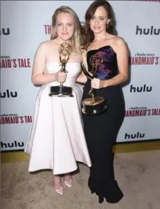  ??  ?? Actresses Elisabeth Moss and Alexis Bledel attend Hulu’s 2017 Emmy After Party on Sunday in Los Angeles.