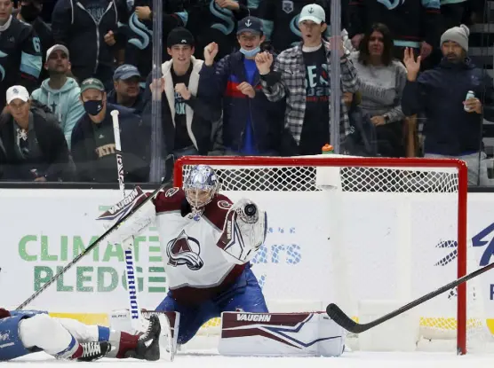  ?? Steph Chambers, Getty Images ?? Kraken fans watch intently as Colorado’s Darcy Kuemper makes a save against Seattle during the third period at Climate Pledge Arena on Friday night.