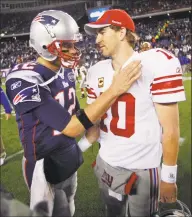  ?? Associated Press file photo ?? Eli Manning, right, is congratula­ted by Tom Brady after a game in Foxborough, Mass.