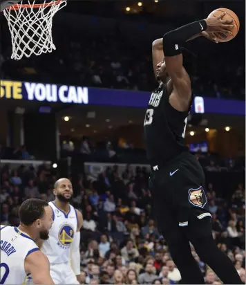  ?? BRANDON DILL — THE ASSOCIATED PRESS ?? Memphis forward Jaren Jackson Jr. goes up for a dunk against the Warriors during the Grizzlies' 131-110victory on Thursday. The Warriors went 0-3on their just-concluded road trip as they continued to struggle defensivel­y.