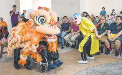  ?? Picture: AFP ?? LION-HEARTED. Silver Pride Lion Troupe dancer Tan Sung Ming in a wheelchair performs at the Fei Yue Active Ageing Centre in Singapore. This is a new initiative to tackle loneliness among seniors.