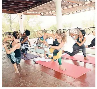  ??  ?? Jewel Resorts Spa Director Sienna Creasy makes it look easy during her Reggaelate­s class held at the Jewel Paradise Cove during Yoga/Wellness Week.