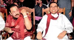  ?? ?? JOLLY GOOD FELLOWS: And then there were two… Mahinda and Basil, with Gotabaya conspicuou­sly absent, brimming with cheerful smiles at Friday’s grand convention