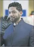  ?? PAUL
BEATY/AP ?? Actor Jussie Smollett smiles and waves to supporters before leaving Cook County Court after his charges were dropped March 26, 2019, in Chicago. Smollett is going on trial this week, accused of lying to police when he reported he was the victim of a racist, homophobic attack downtown Chicago nearly three years ago. Jury selection is scheduled for Monday.