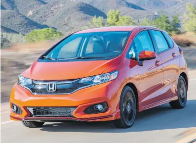  ?? HONDA ?? The new Fit gets a revised front and rear appearance, along with a new two-piece chrome and piano-black grille.