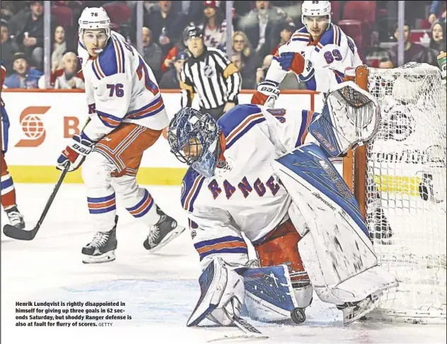  ?? GETTY ?? Henrik Lundqvist is rightly disappoint­ed in himself for giving up three goals in 62 seconds Saturday, but shoddy Ranger defense is also at fault for flurry of scores.