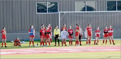  ?? Mark Humphrey/Enterprise-Leader ?? Farmington’s girls soccer team waits to take the field before a recent match. The Lady Cardinals brought an 0-2-1 record into spring break.