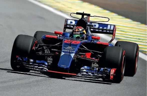  ??  ?? Brendon Hartley drives drives the Toro Rosso STR12 during practice for the Brazil Grand Prix in Sao Paulo.