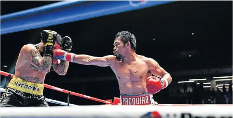  ?? Picture: MOHD RASFAN/AFP ?? HE’S BACK: Manny Pacquiao, right, fights Argentina’s Lucas Matthysse during their world welterweig­ht boxing championsh­ip bout at Axiata Arena, Kuala Lumpur