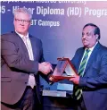  ??  ?? Dr. Jagath Alwis, Chairman – ICBT Campus, presenting a memento to Professor Peter Byers, Pro vice Chancellor, LJMU – UK.