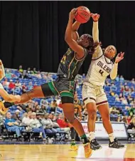  ?? Ronald Cortes/Contributo­r ?? Pearland’s Paige Bonner, right, battles DeSoto’s Ma’Riya Vincent for a rebound in a UIL Class 6A state semifinal Friday at the Alamodome.