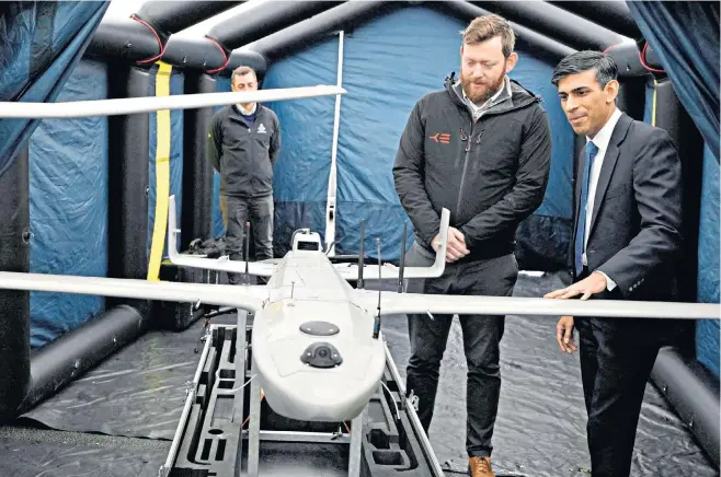  ?? ?? Rishi Sunak inspects a drone used for the surveillan­ce of vessels in distress in the Channel