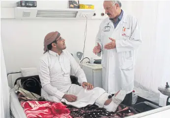  ??  ?? ROAD TO RECOVERY: Abdallah, 29, who lost his right leg after an explosion in Yemen, speaks with a counsellor inside a Medecins Sans Frontieres hospital in Amman.