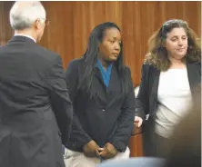  ?? Robinson Kuntz / Associated Press ?? Ina Rogers (center) appears in Solano County Superior Court in Fairfield to face multiple charges of felony child abuse. Bail for the mother of 10 was set at nearly $500,000 after the judge said she remains a danger to the children.