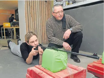  ?? ?? TENSIONS: Military training for schoolchil­dren living in Lviv, Ukraine.