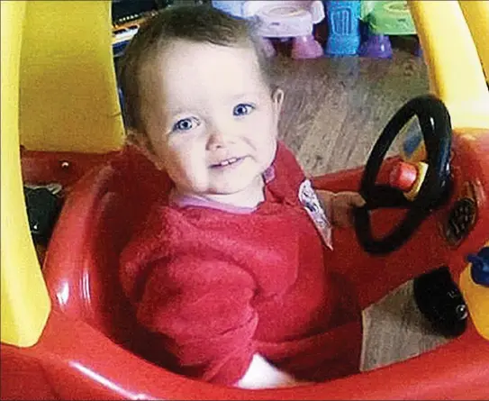  ??  ?? Full of life: Poppi Worthingto­n plays happily in a toy car. She died of suffocatio­n hours after a brutal assault by her father