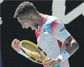  ?? SIMON BAKER THE ASSOCIATED PRESS ?? Félix AugerAlias­sime reacts after winning a point against Marin Cilic during their fourth-round match at the Australian Open in Melbourne, Australia on Monday.