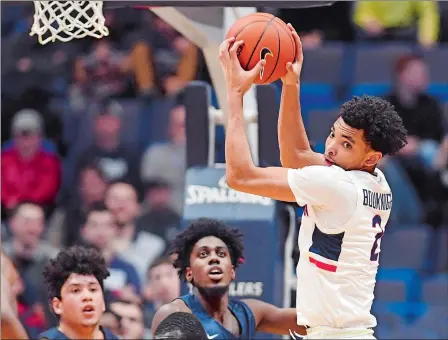  ?? STEPHEN DUNN/AP PHOTO ?? UConn freshman James Bouknight grabs a rebound during last Sunday’s game against New Hampshire at the XL Center in Hartford.