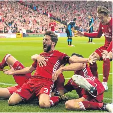  ??  ?? Graeme Shinnie celebrates scoring the winner.