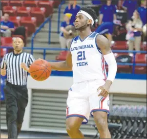 ?? Submitted photo ?? BACK WITH A BAND: Louisiana Tech sophomore Exavian Christon scans the court on Thursday during the team’s 103-58 exhibition victory against Union University at the Thomas Assembly Center in Ruston, La. Christon said he is bringing back the headband this season for the first time since high school. Photo by Donny Crowe, courtesy of Louisiana Tech Communicat­ions.