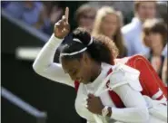  ?? KIRSTY WIGGLESWOR­TH — THE ASSOCIATED PRESS ?? Serena Williams of the United States celebrates winning her women’s singles quarterfin­als match against Italy’s Camila Giorgi, at the Wimbledon Tennis Championsh­ips, in London, Tuesday.