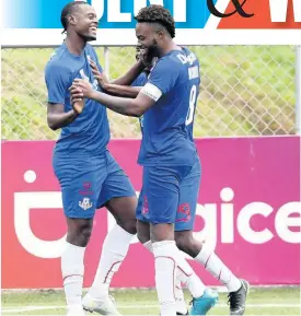  ??  ?? Portmore United’s Chevany Willis (left) celebrates with team-mate Ricardo Morris after scoring against Humble Lion at the UWI/Captain Horace Burrell Centre of Excellence on Sunday.